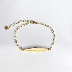 Gold Paper Clip Mindfulness Bracelet Engraved with the phrase "i let go of what i can't control"